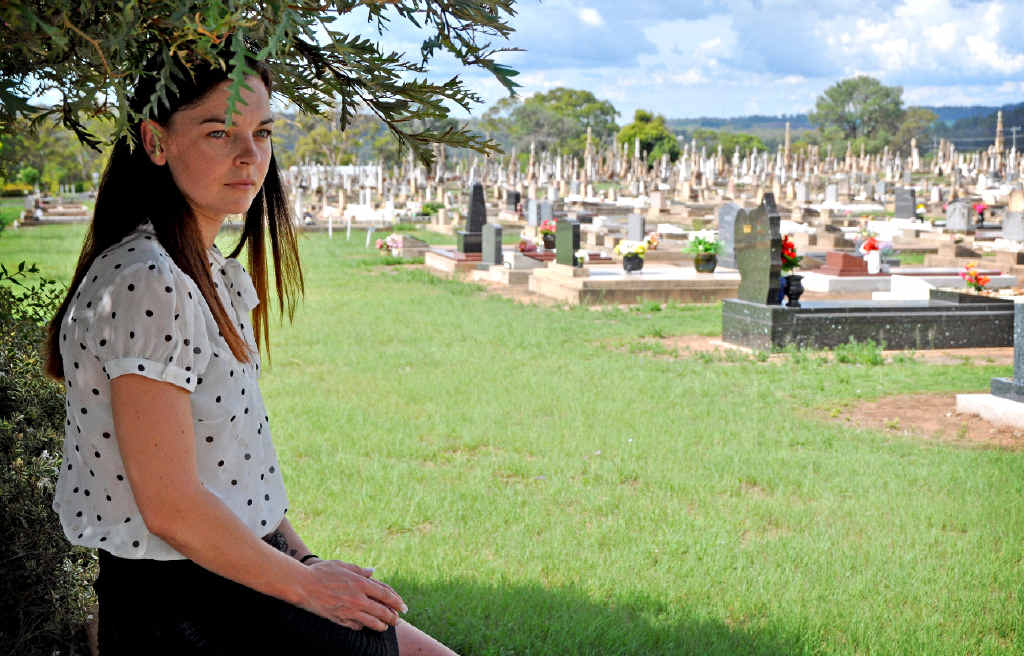 NO COMMUNICATION: Mother Tahni Farrell wants to know why she wasn’t notified of a clean-up being done around her children’s graves (inset, left) that resulted in the plaques being moved and a granite slab being dug up.
